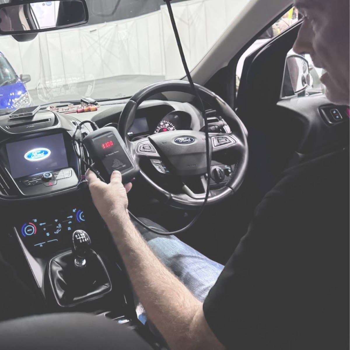 ALA member performing diagnostics on a Ford